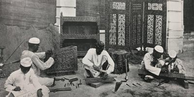Wood carvers in a British-run workshop in Allahabad, c. 1903. Source: Maffey, A Monograph on Woodcarving in the United Provinces of Agra and Oudh, 1903