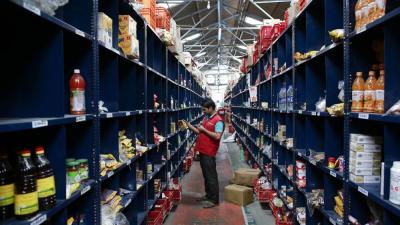 An employee scans a package for an order at a Big Basket warehouse on the outskirts of Mumbai November 4, 2014. Photo: Reuters/Danish Siddiqui