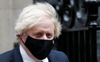 Britain's Prime Minister Boris Johnson walks outside Downing Street in London, Britain, December 8, 2021. REUTERS/Peter Nicholls


