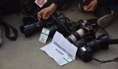 Representative image of Kashmiri journalists displaying their broken cameras. Photo: Reuters/File