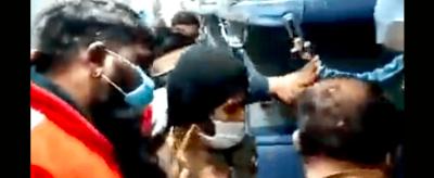 Video screengrab showing a Muslim passenger being dragged out of an Ajmer-bound train by VHP men.