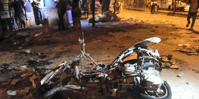 A torched scooter following the clash at Jahangirpuri on Saturday, April 16, 2022. Photo: PTI