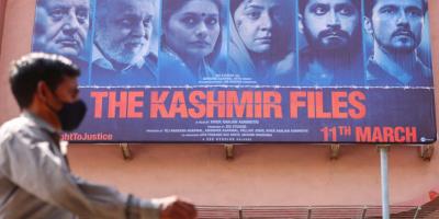 A man walks past a poster of Bollywood movie 'The Kashmir Files' outside a cinema in Mumbai, India, March 16, 2022. Photo: Reuters/Francis Mascarenhas