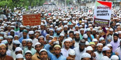 Muslims take part in a procession after the Friday prayers to protest against the blasphemous comments on Prophet Muhammad by BJP members, in Dhaka, Bangladesh. Photo: Mohammad Ponir Hossain/Reuters.