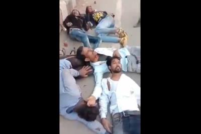 Muslim men who were beaten and forced to sing the national anthem by the Delhi police. Photo: Video screengrab
