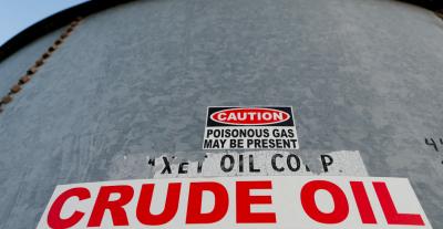 A sticker reads 'crude oil' on the side of a storage tank. Photo: Reuters/File