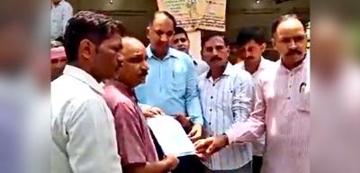 Attendees of the Haryana panchayat hand over a memorandum calling for 'action' against 'illegal immigrants' to a duty magistrate. Photo: Video screengrab