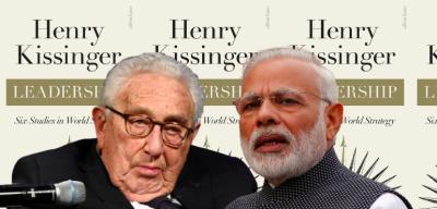 Henry Kissinger and Narendra Modi. In the background is the cover of Kissinger's new book. Photo: Reuters