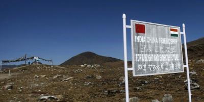 A signboard is seen from the Indian side of the Indo-China border at Bumla, in Arunachal Pradesh. Photo: Reuters/Adnan Abidi/File Photo