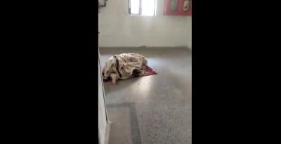 A video screengrab showing a woman offering namaz at a UP hospital. 