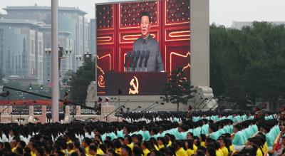 Chinese President Xi Jinping is seen on a giant screen as he delivers a speech at the event marking the 100th founding anniversary of the Communist Party of China, on Tiananmen Square in Beijing, China July 1, 2021. Photo: Reuters/Carlos Garcia Rawlins
