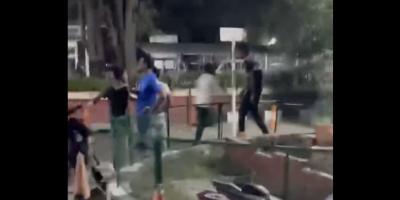 Screengrab from a video, showing a man who appears to be the shooter, running away.
