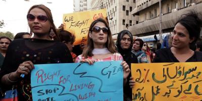 Members of the transgender community hold signs against the anti-begging law for the transgender community, during a protest demanding jobs in Karachi, on April 10, 2019. Photo: Akhtar Soomro/Reuters