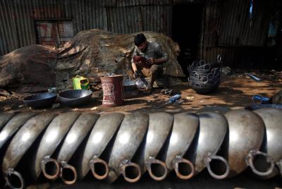 Representative image. A man makes iron frying pans at his workshop in an industrial area in Mumbai, India, November 30, 2017. Credit: Reuters/Shailesh Andrade