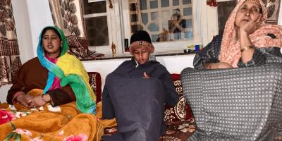 Puran Krishen Bhat's sister-in-law Sunita, her minor son, and her mother at their residence in Choudhary Gund village of Shopian. Photo: Jehangir Ali/The Wire
