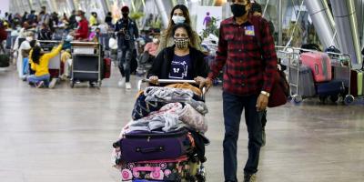 File image: Passengers wearing face mask come out from Sardar Vallabhai Patel International Airport amid concerns over Omicron variant of coronavirus on Thursday, December 9. Photo: PTI