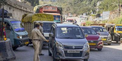 Assam Police personnel stop Meghalaya-bound vehicles for safety reasons, a day after violence at a disputed Assam-Meghalaya border location that killed six people, in Jorabat, Wednesday, Nov. 23, 2022. Photo: PTI
