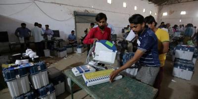 Election staff check Voter Verifiable Paper Audit Trail (VVPAT) machines and Electronic Voting Machines (EVM) ahead of India's general election at a warehouse in Ahmedabad, India, March 6, 2019. Credit: Reuters/Amit Dave/File Photo