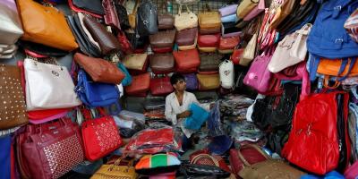 A vendor arranges bags as he waits for customers at his shop at a market in Mumbai, India, January 6, 2017. Photo: Reuters/Danish Siddiqui/File Photo