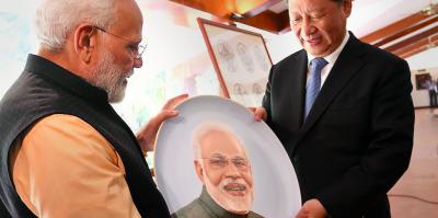 Prime Minister Narendra Modi and Chinese President Xi Jinping exchange gifts at Mamallapuram. Photo: PTI/Files