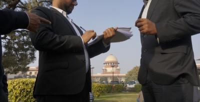 Representative image of lawyers conferring against the backdrop of the Supreme Court. Photo: Shome Basu