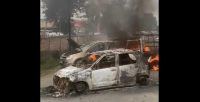 A video screengrab of cars burning in Manipur. Photo: Twitter/@MithilaWaala
