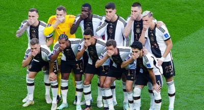 Germany's players protest by covering their mouths in Qatar ahead of a World Cup match, against the banning of rainbow armbands. Photo: File