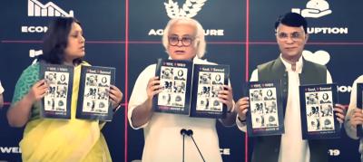 Congress leaders Supriya Shrinate, Jairam Ramesh and Pawan Khera release the 'Nau Saal, Nau Sawaal' booklet on May 26, 2023. Photo: Screengrab via YouTube/Indian National Congress