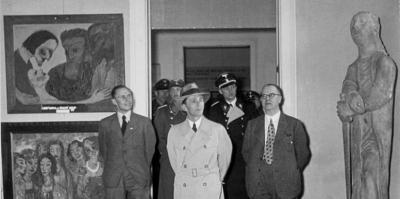 Nazi Minister of Public Enlightenment and Propaganda Joseph Goebbels examining what his party called 