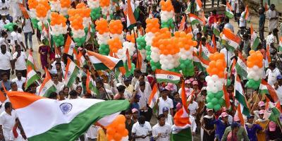 Congress party workers and supporters hold national flags during a Freedom March to celebrate the 75 years of India's Independence in Bengaluru, Monday, Aug. 15, 2022. Photo: PTI