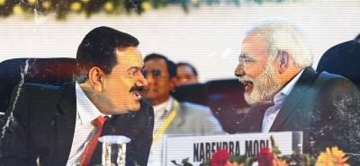 Narendra Modi and Gautam Adani at the Vibrant Gujarat summit. Credit: Twitter/Files