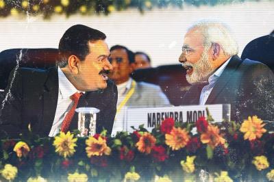 Narendra Modi and Gautam Adani at the Vibrant Gujarat summit. Photo: Twitter/Files