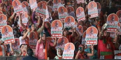 A group of women hold poster of Prime Minister Narendra Modi at an election rally in Rajasthan. Photo: Facebook/narendramodi