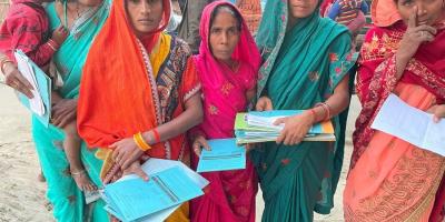 Women of Mishrauli village with their loan papers. Photo: Manoj Singh