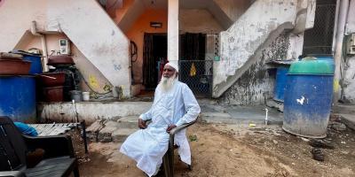 Mohd Abdul Hameed Sheikh sits outside his CISF marked home in Citizen Nagar. Photo: Tarushi Aswani