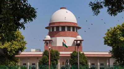 The Supreme Court of India building, with the tricolour at the forefront. Photo: Wikimedia Commons