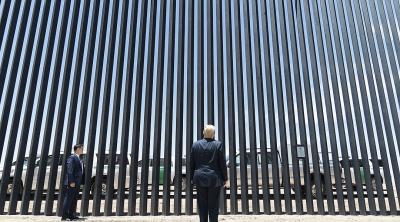 Donald Trump with a section of border wall near Yuma, Arizona, June 2020. Photo: Shealah Craighea/White House