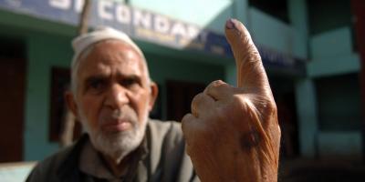 A man shows his inked finger after voting in Kashmir in 2009. Photo: Public.Resource.Org/Flickr (CC BY 2.0 DEED)