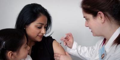 A woman getting a vaccine shot. Photo: Unsplash