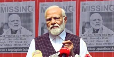 Narendra Modi during his address on Manipur today. In the background are posters that had come up in Manipur, criticising Modi's silence. 