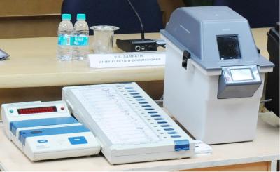 A VVPAT machine is on the right. Photo: PIB.