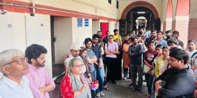 Delhi University students and professors discussing the humanitarian crisis in Gaza and reciting poems in the university premises after the authorities cancelled an event on Palestine. Photo: Special Arrangement